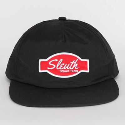 China Bill 5 Panel 100% COMMON Black Flat Nylon Unstructured Hat With Embroidery Patch for sale