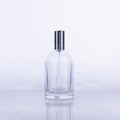 China Personal Care 100ml Clear Shoulders Glass Cylindrical Sloping Perfume Bottle Empty With Pump for sale