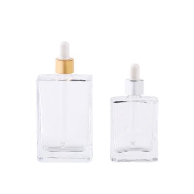 China Cosmetic 50ml 100ml empty transparent transparent square shape essential oil bottle with dropper for sale