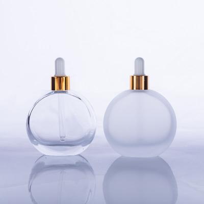 China Fancy Round Shape Cosmetic 50ml Frosted Iridescent Clear Color Custom Dropper Bottles With Dropper Cap For Hair Essential Oil Serum for sale