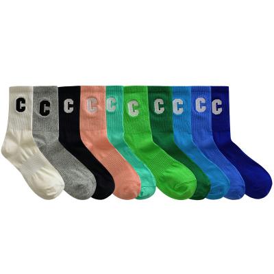 China Custom Solid Color Logo Sports Tube Women Unisex Men's Simple Black White Breathable Crew Socks for sale