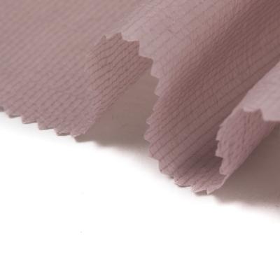 China 100 Polyester Waterproof Wrinkle Elastic Ribstop Recycled Waterproof Fabric For Coat And Dress for sale