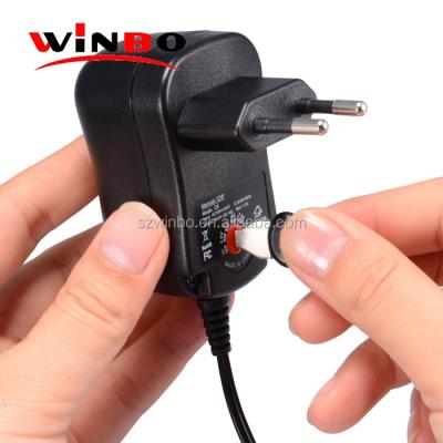 China Universal Mobile Phone US AU EU Plug DC to AC Adapter 12W Changing Power Supply with Six Adapter Tips for 3V 12V for sale