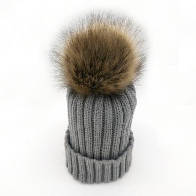 China 2021 COMMON hot sale hot mommy and me knitted winter faux fur hat baby pom pom fur ball cap for sale