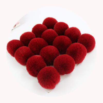 China 2022 Hot Sale 6cm Small Size Auto Faux Fur Upholstery Pom Poms Ball With Elastic Band For Beanie Hat for sale