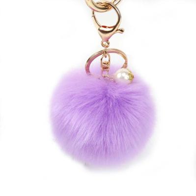 China Faux fox pom poms with elastic band 2022 hot pink fur pom pom sale keychain with pearl /genuine fur pom poms/fox fur pom pom keychains for sale