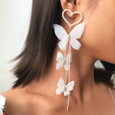 China Hyperbole New Design Exaggerated Tassel Holiday Party Bohemian Earrings Long White Butterfly Earrings Jewelry For Women Jewelry for sale