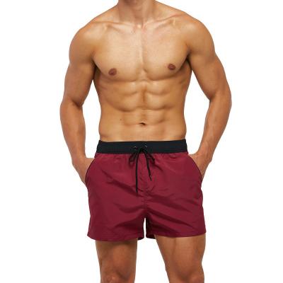 China Breathable Mens Surf Shorts Solid Color Mesh Lining Boxer Shorts Beach Pants Mens Swimwear Shorts for sale