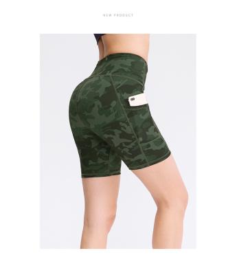 China Antibacterial Fitness Sportswear Athleisure Workout Women Gym Running Shorts With Phone Pocket for sale