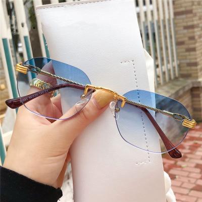 China Multi-colored frameless small frame street men's and women's sunglasses fashion sunglasses 2021 new gradient metal glass sunglasses for sale