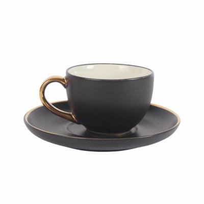 China Viable 5oz Porcelain Coffee Cup and Saucer Set Factory Price Ceramic Matte Coffee Cups and Saucers with Gold Rim and Handle for sale