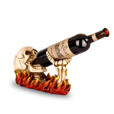 China Europe Resin Skeleton In Flames Wine Rack Tabletop Display Rack for sale