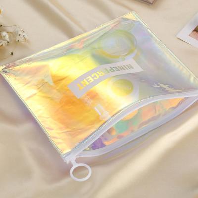 China Low moQ moisture proof hot sale holographic laser bags custom made to your own logo high quality pvc laser zipper bag for sale