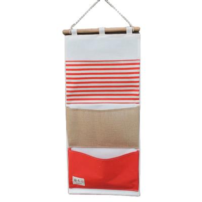 China Sustainable Wholesale High Quality House Wall Storage Cotton Fabric Hanging Bags for sale