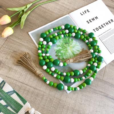 China Europe Easter and Tassel Garland Farmhouse Rustic Beads St Patrick's Day Wood Bead Garland with Jute Rope for sale