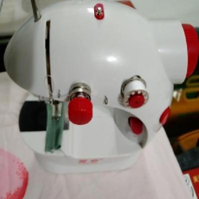 China TRIMMER Mini Household Portable Electronic Cheap THREAD Embroidery and Sewing Machine for sale