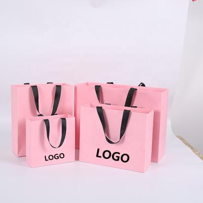 China Recyclable Logo Luxury Shopping Bag Pink Custom Paper Bag With Ribbon Handle for sale