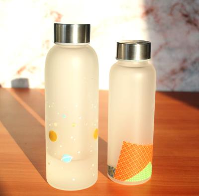 China New Arrival 360ML Sustainable Silicone Spraying Frosted Glass Water Bottle With Stainless Steel Lid for sale