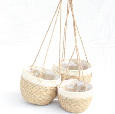 China Cheap Sustainable Handmade Garden Plant Flower Wicker Basket Flower Pot, Hanging Planter Cornleaf Set for sale