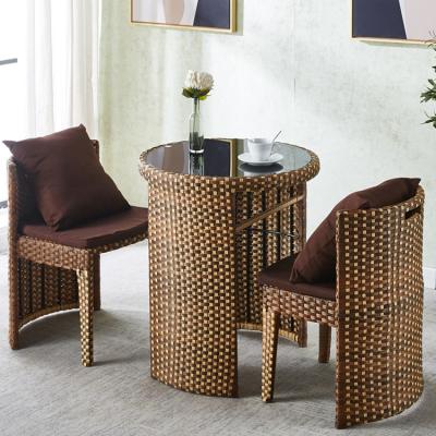 China Rattan Tempered Glass Round Dining Table and Chair Set for Coffee Shop Modern Design for sale