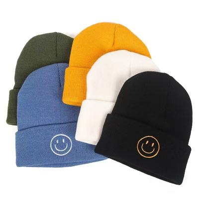 China COMMON Casual Simple Black Color Winter Beanie Hats Smile Embroidery Acrylic Knitted Custom Logo For Unisex Woman And Men Wholesale for sale