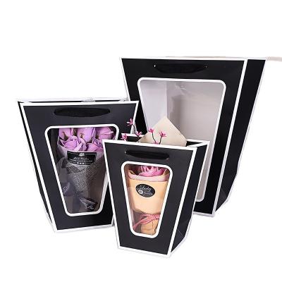 China Recycled Materials Flower Transparent Packinghot Sale Paper Bag Hand Flower Box Gift Bag Window Bouquet Purse With Rectangular Window Folding TX for sale