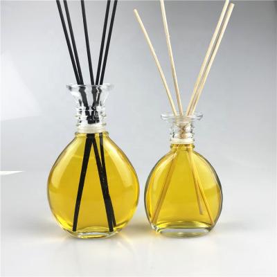 China 30ml 60ml 100ml 200ml Drop Shape Clear Elegant Round Personal Care Flat Tubular Glass Bottle Diffuser Glass Bottle for sale