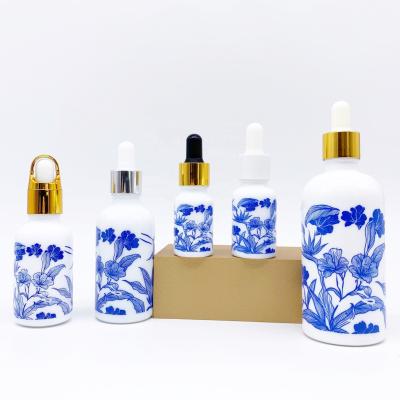 China Wholesale 10ml 15ml 30ml 50ml 100ml personal care china essential oil dropper white bottle with blue chinese features and white por for sale