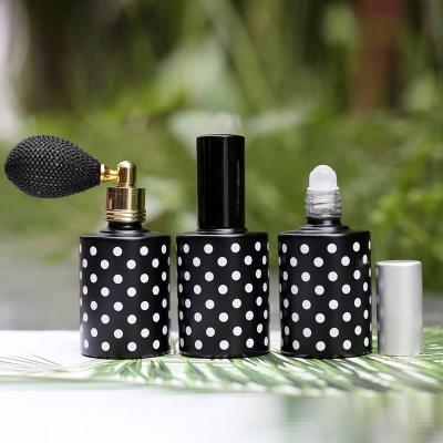 China Wholesale Custom Personal Care Mini Cylindrical Black 12ml Perfume Bottle for sale