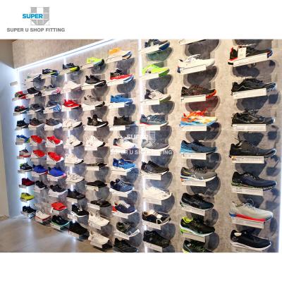 China Neat Commercial Sneaker Shoe Shop Design Sports Retail Store Custom Display Rack Marble Wall Mount Led Shelves Show Shoes for sale