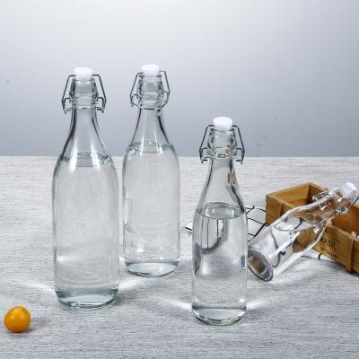 China Beverage Sealed Glass Bottle Juice Seasoner Water Drinking Milk Transparent Portable Cold Tea Coffee Beverage Round Bottle With Lids for sale