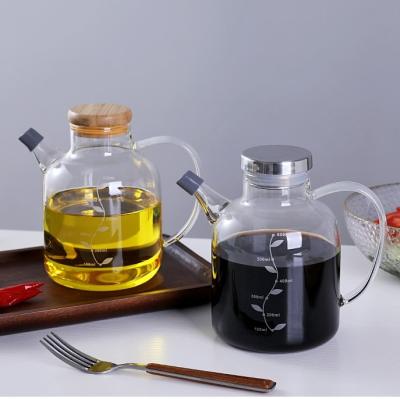 China Portable Glass Olive Oil Dispenser With Handle Pot Seasoner Bloated Belly Transparent Soy Vinegar Kitchen Bottle Wholesale Viable Glass for sale