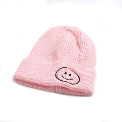 China 2021 COMMON Pink Toddler Knit Beanie Baby Smiley Face Beanie Hat Custom Knit Beanies With Logo for sale