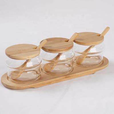 China Sustainable 3pcs Spice Jar Set With Spoon Tray Base Glass Bamboo Food Container for sale