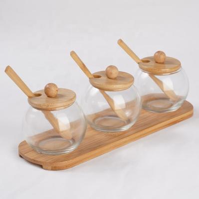 China 3pcs Sustainable Glass Storage Sugar Jar Set With Lid Bamboo Ball Jar Container With Spoon for sale