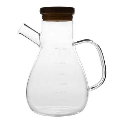 China 700ml Round Shape Glass Sustainable Empty Clear Bottle For Oil Kitchen Use for sale