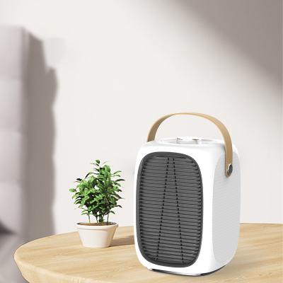 China Small Household Hotel Household Ceramic Heater 3s Quick Heater Desktop Ceramic Fan PTC Mini Electric Radiator Fan Adjustable for sale