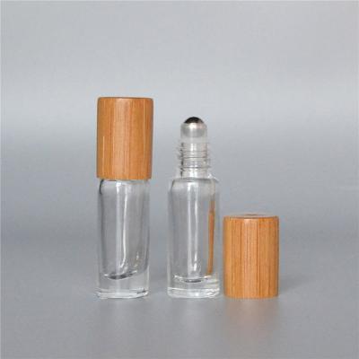 China 3ml 15ml Cosmetic Eco Friendly Bamboo Round Cosmetic Oil / Perfume Glass Roll On Bottle for sale