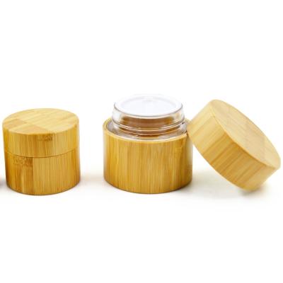 China Recyclable Material Glass Bottle Jar Packaging With Bamboo Cosmetic Packaging for sale