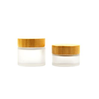 China Recyclable Material Cosmetic Packaging Bamboo Lid And Frost Glass Jar 15g 30g 50g 100g Glass Cream Bottles for sale