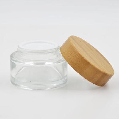 China Personal Care Clear Glass Cream Jar With Bamboo Lid for sale