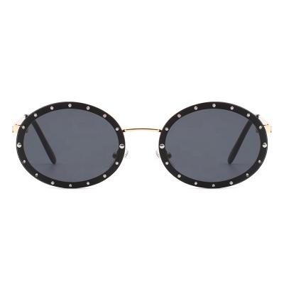 China UV400 Circle Glass Colored Sun Glasses Round Shades Men Women Shape Metal Sunglasses for sale