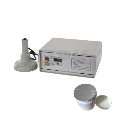 China HZPK DCGY-1000 Mini Food Hand Plastic Glass Jar Can Cover Lid Aluminum Foil Heat Induction Packing Sealer Hot Sealing Machine for sale