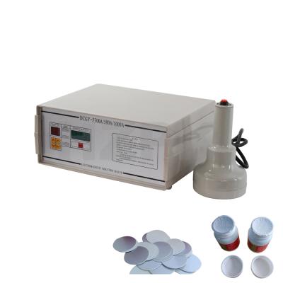 China HZPK DCGY-500 Mini Hand Food Glass Bottle Plastic Jar Can Cover Lid Aluminum Foil Heat Induction Packing Sealer Hot Sealing Machine for sale