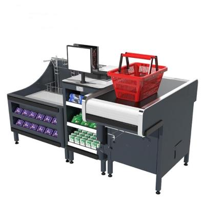 China Electric Checkout Counter Supermarket Cashier Counter With Conveyor Belt Bag Holder for sale