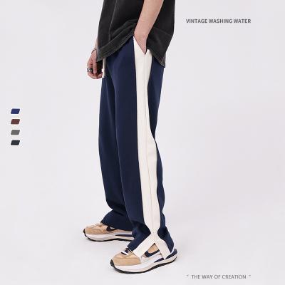 China Anti-wrinkle 2022 summer simple and comfortable men's side stitching spring and side split casual pants for teenagers straight wide leg pants for sale