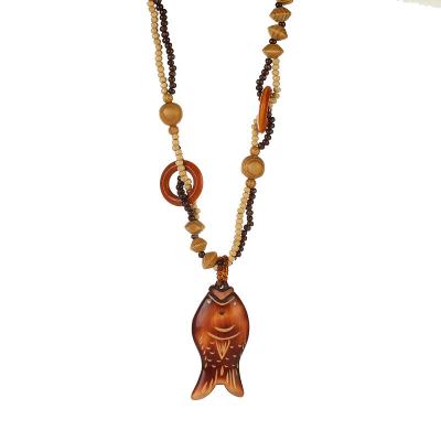 China Retro Small Peacock Owl Fish Necklace Bohemia Ethnic Wood Chain Sweater Beaded Hiphop Jewelry Necklace for sale