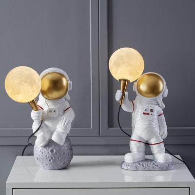 China Modern Led Astronaut Statue Lights Portable Abstract Art Table Light 3D Moon Night Light Creative Dining Table Beauty Display Lantern for sale