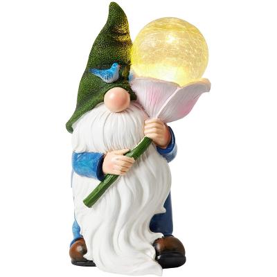 China Europe Fairy Garden Gnome Outdoor Christmas Decoration Carrying Magic Globe With Solar LED Lights For Patio Yard Home Lawn for sale