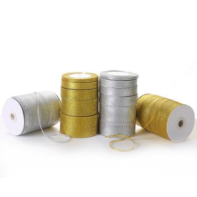 China Viable Wholesale Multiple Sizes Glitter Gold Ribbons Gift Tying Wrapping Webbing DIY Christmas Ribbons for sale